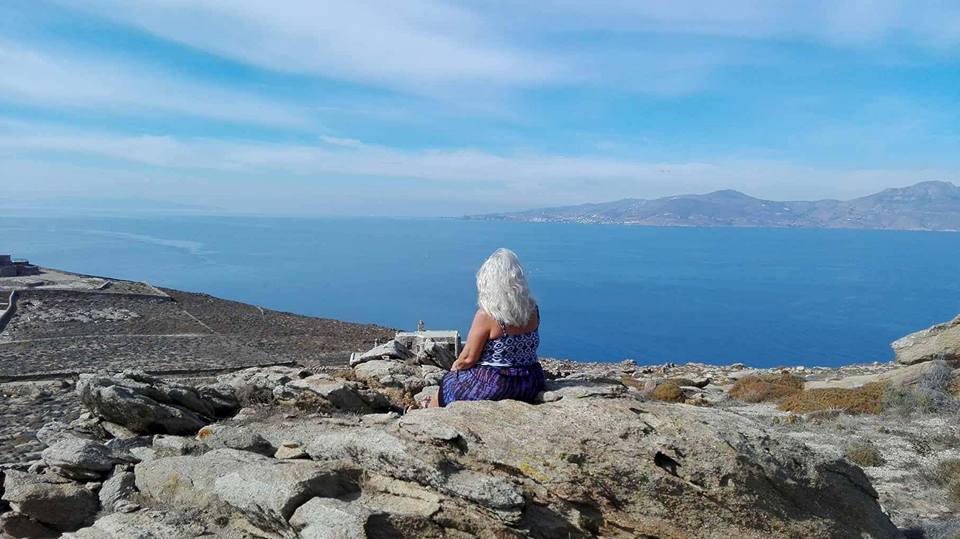 Stacey -viewing-tinos-from-below-mykonos-lighthouse